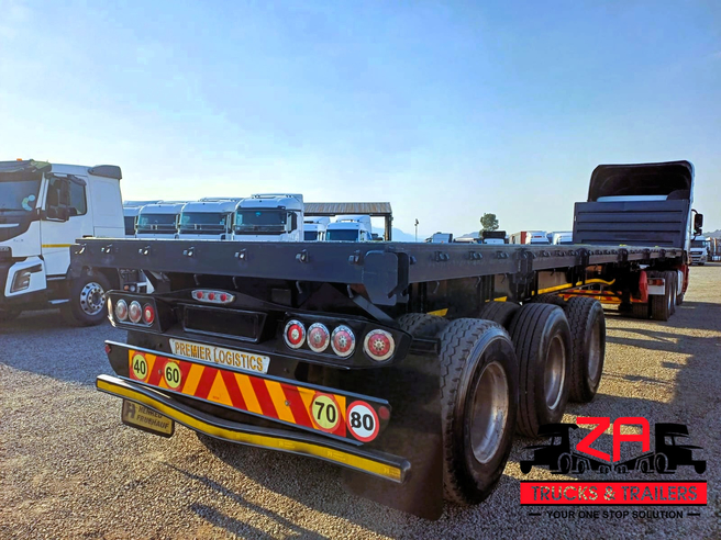 2023 HENRED FRUEHAUF TRI-AXLE FLAT DECK
